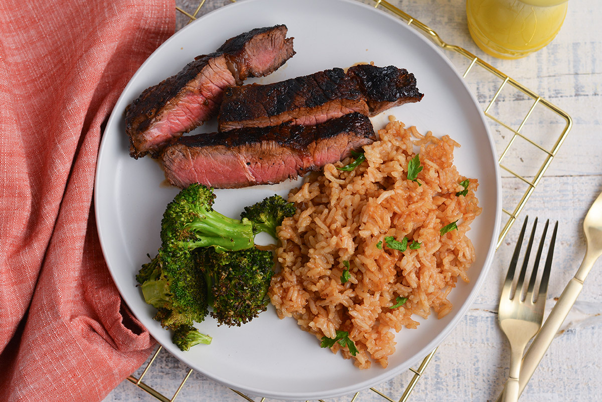 overhead shot of plate with steak, broccoli and rice