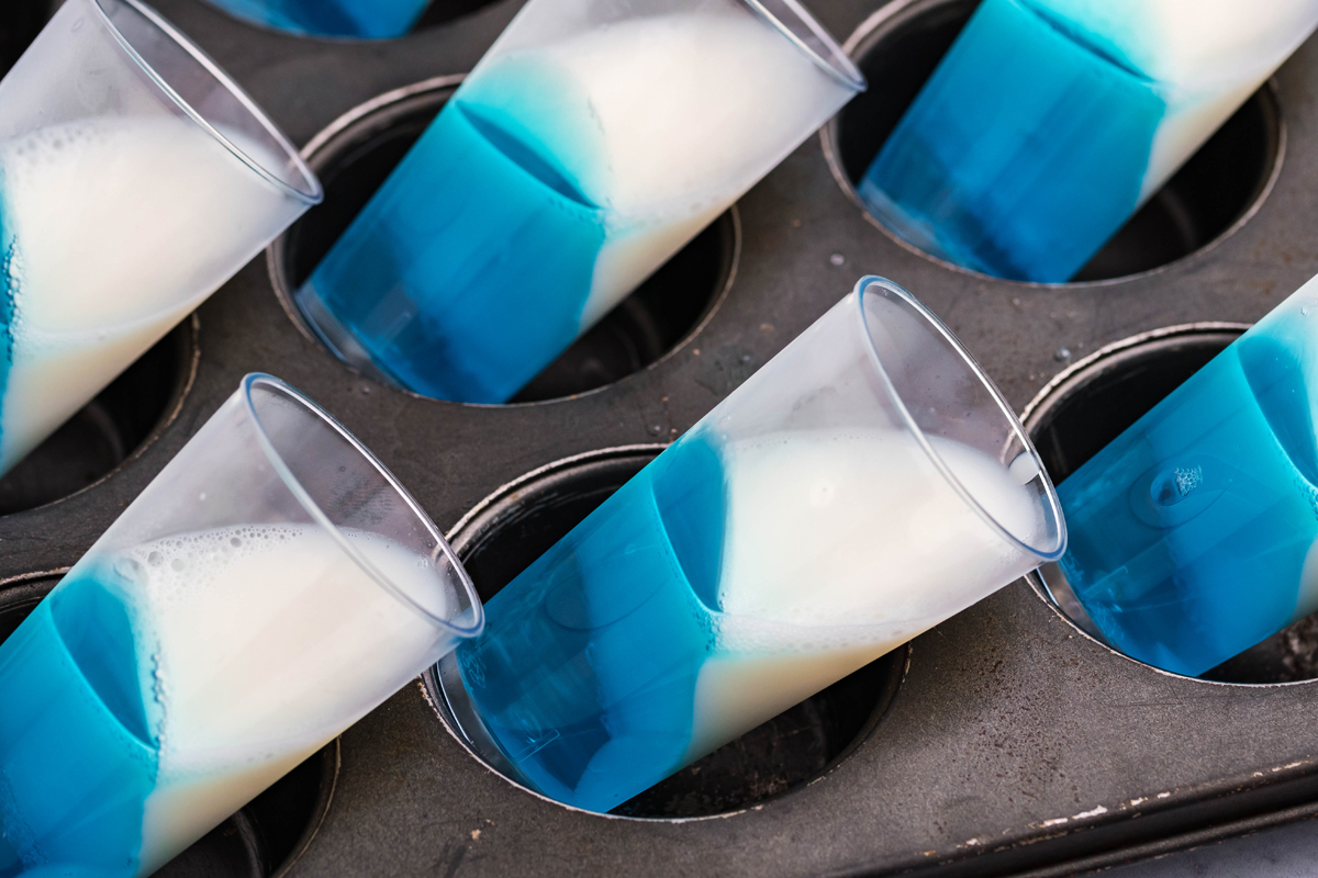 white and blue jello in cups