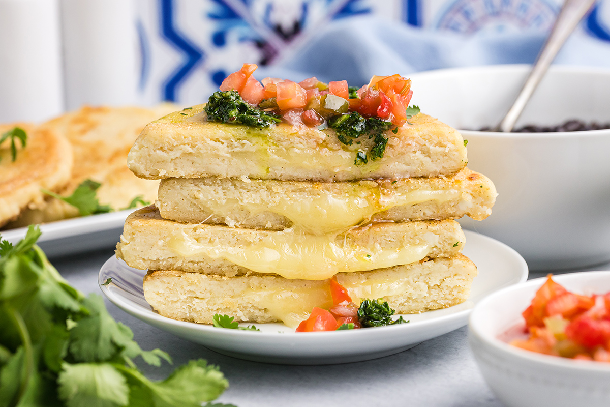 straight on shot of stack of arepas cut in half