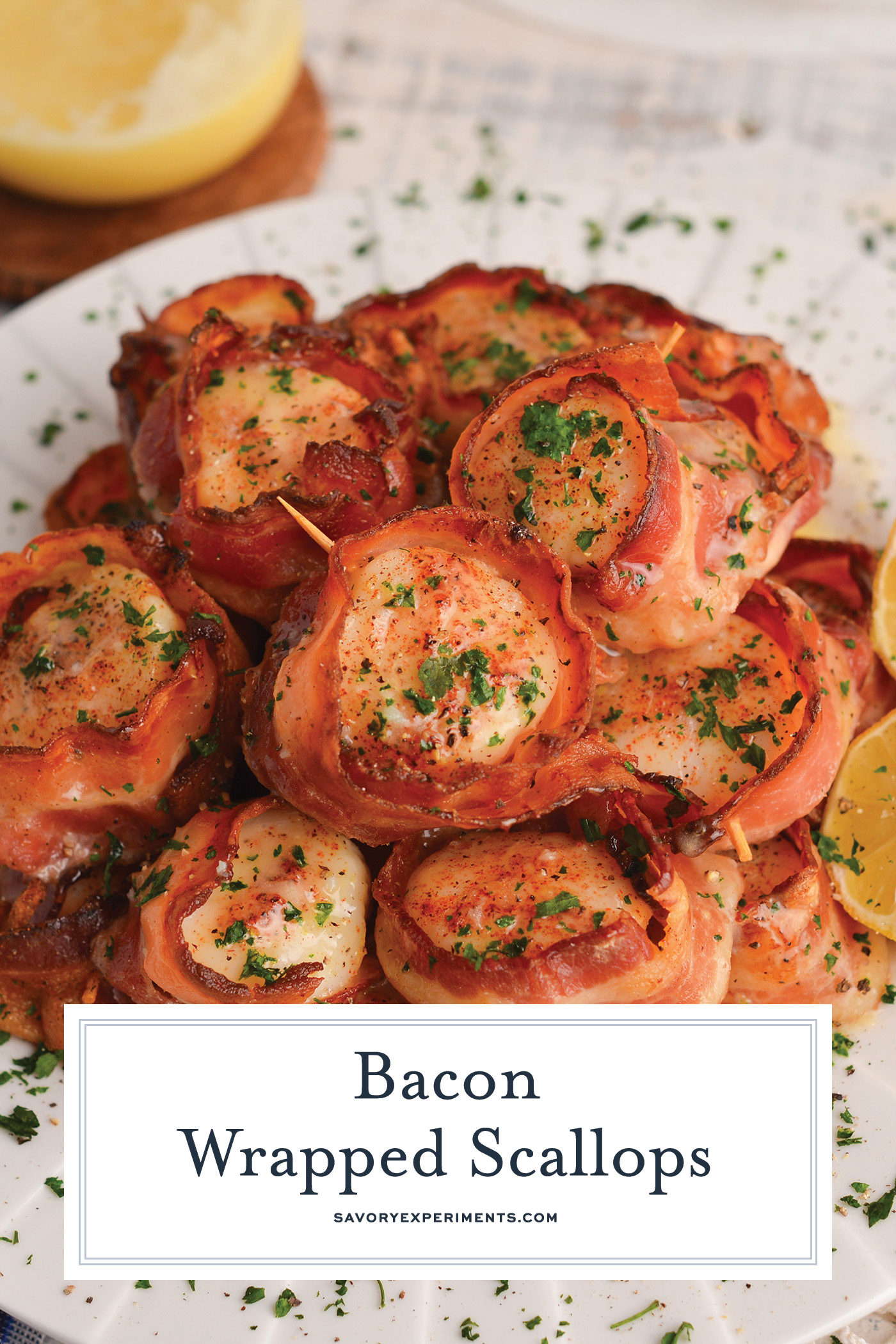 angled shot of plate of scallops wrapped in bacon with text overlay