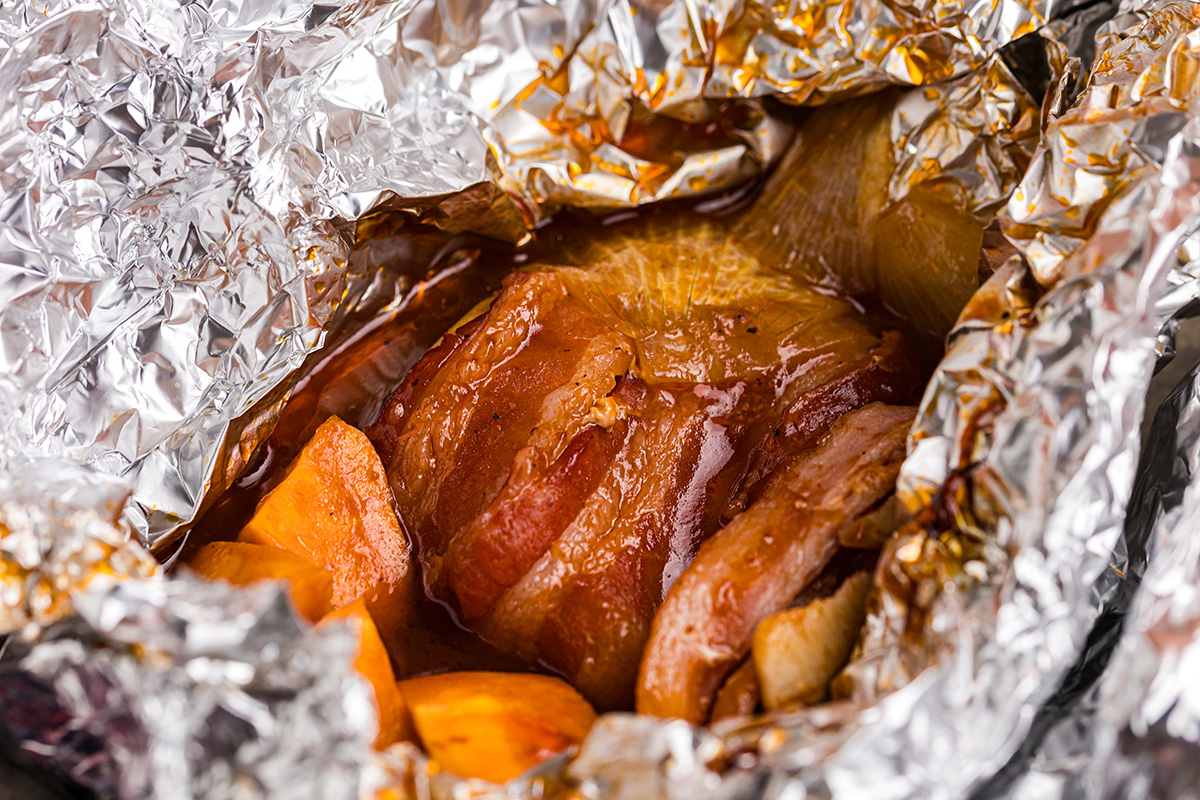 close up angled shot of chicken foil packet opening