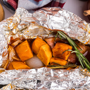 close up shot of chicken foil packet opening