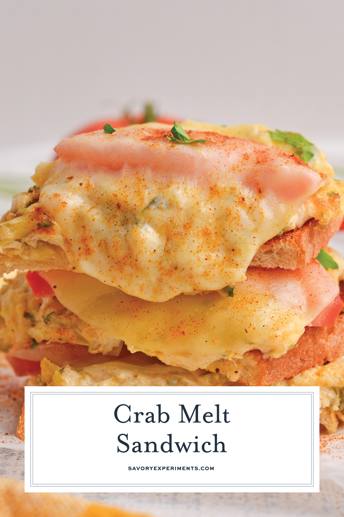 straight on shot of stack of crab sandwich with text overlay