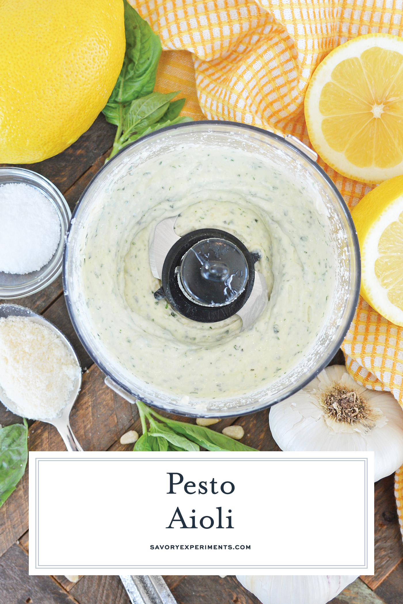 overhead shot of pesto aioli in food processor with text overlay