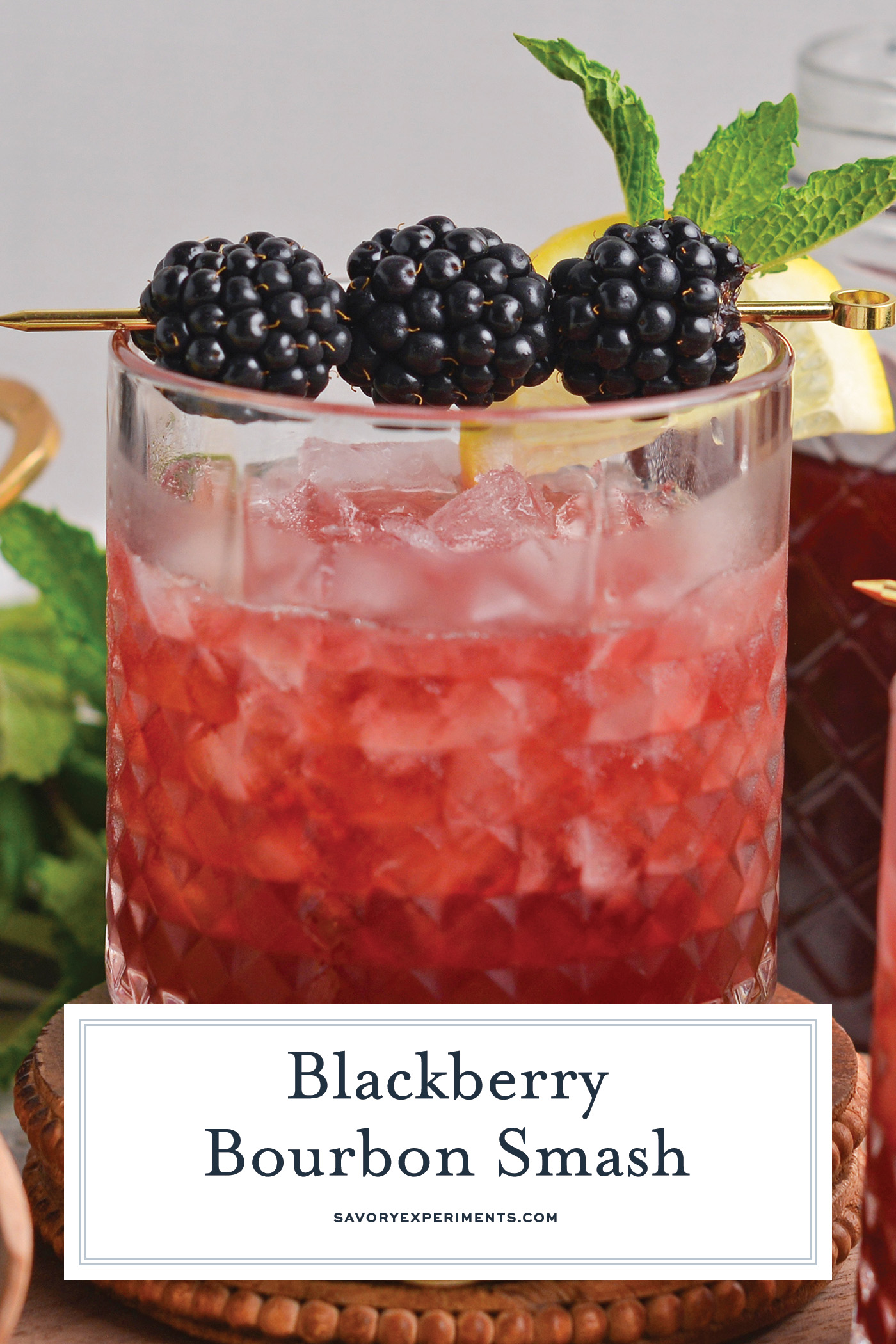 straight on shot of blackberry bourbon smash with text overlay