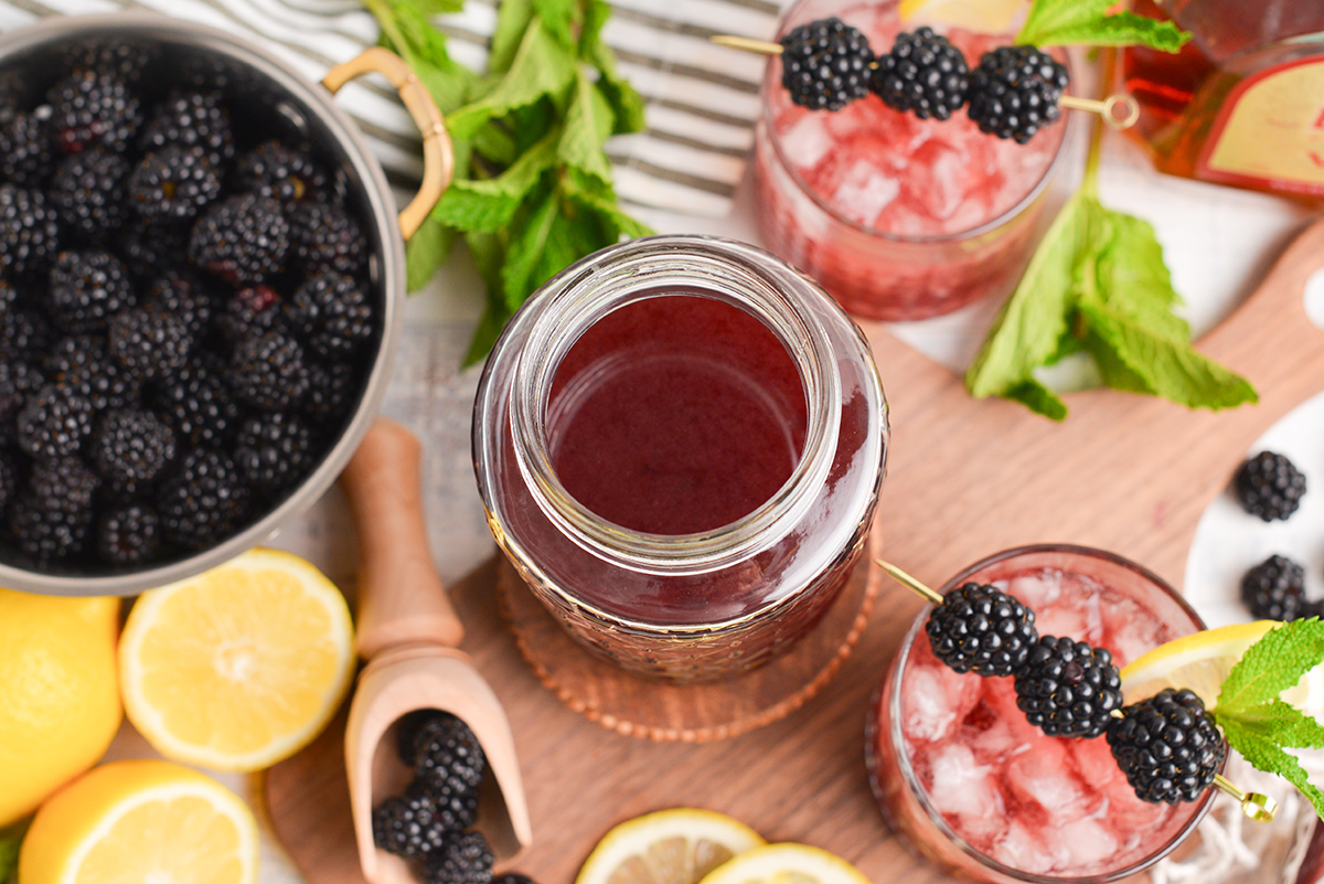 overhead shot of blackberry brandy in a jar