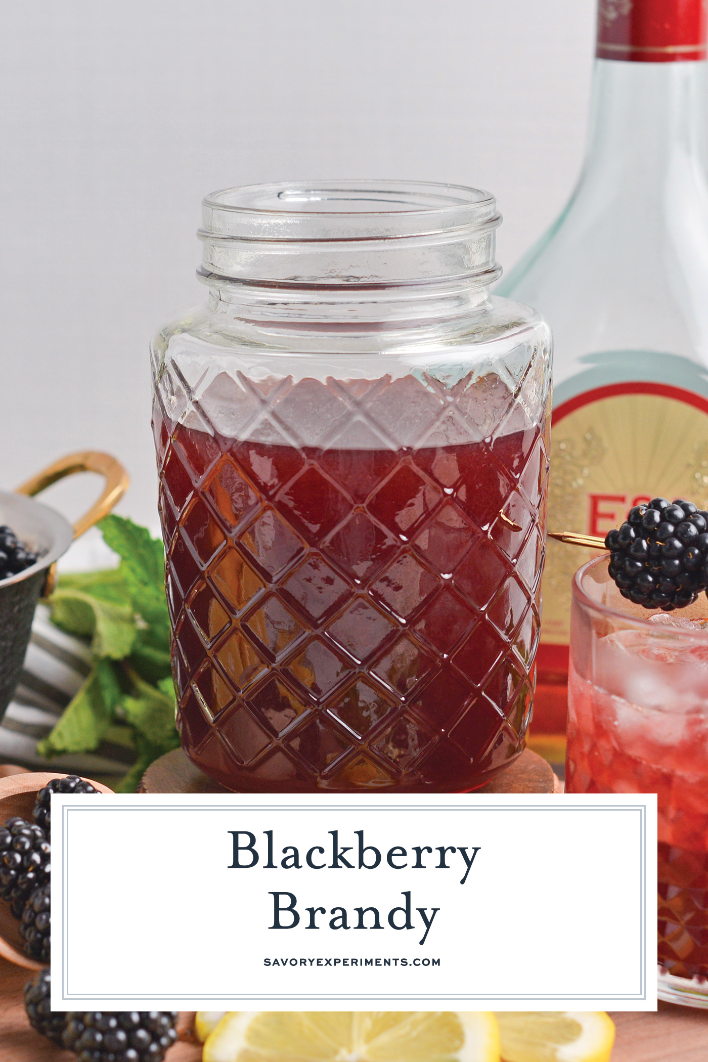 jar of homemade blackberry brandy with text overlay