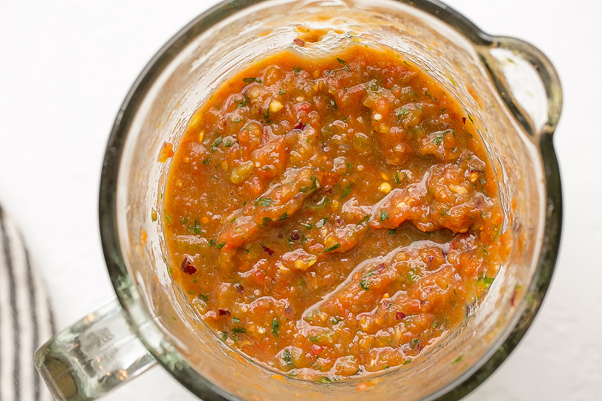 overhead shot of salsa in blender