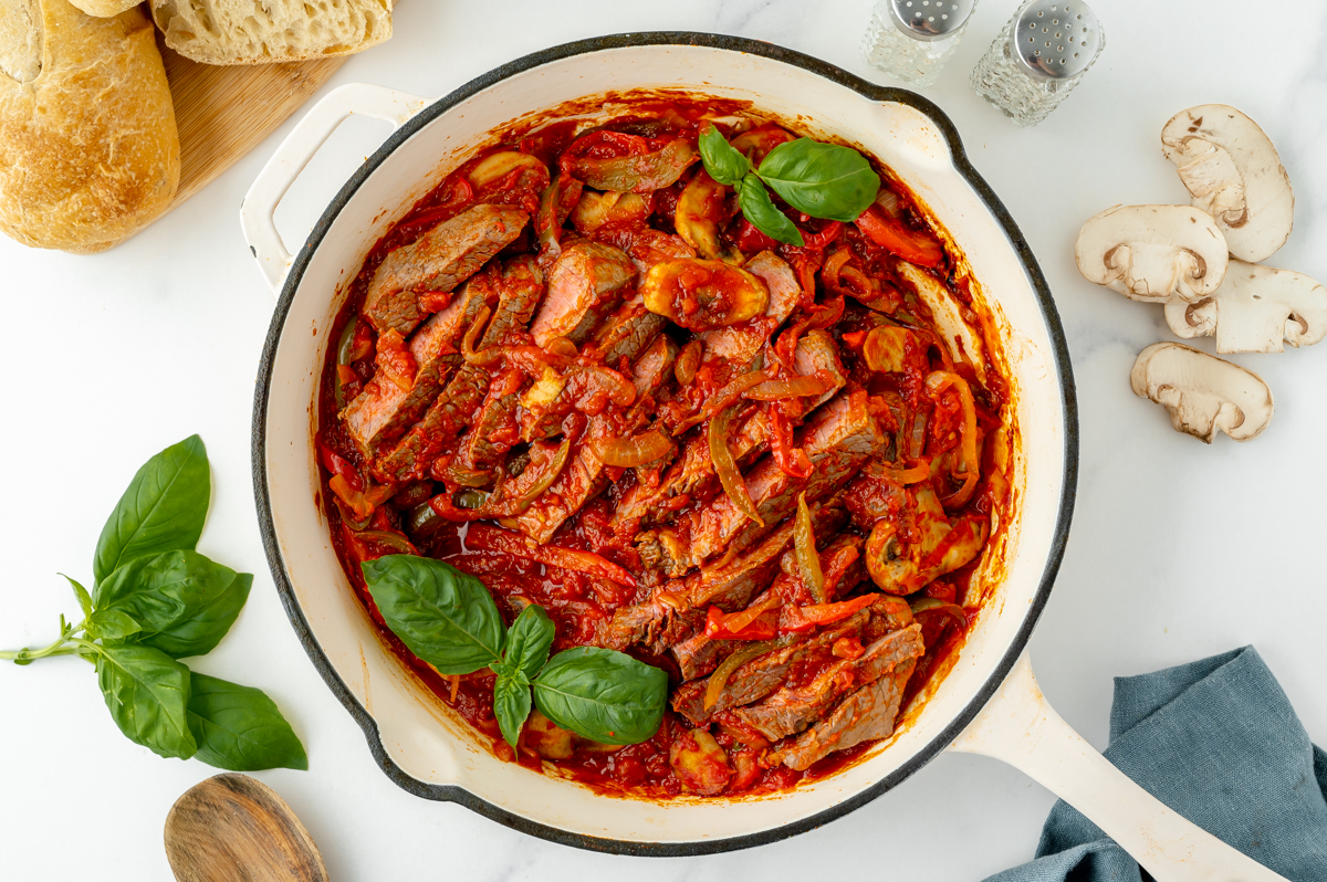 overhead shot of carne alla pizzaiola in a pan