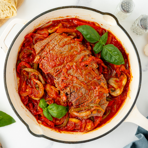 overhead shot of pan of carne alla pizzaiola