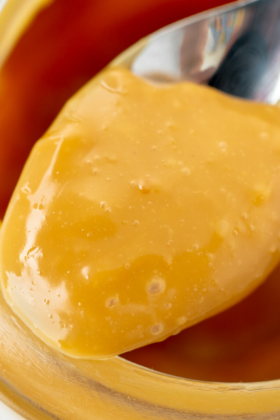 close up shot of spoon of caramel