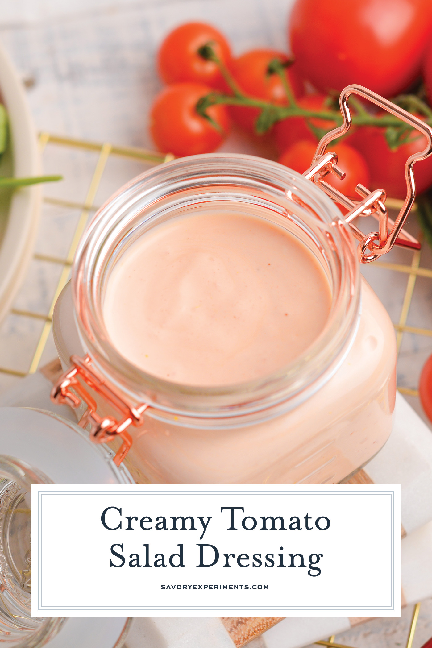 angled shot of jar of creamy tomato salad dressing with text overlay