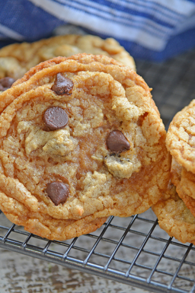 angled shot of flourless peanut butter cookies on cooling rack