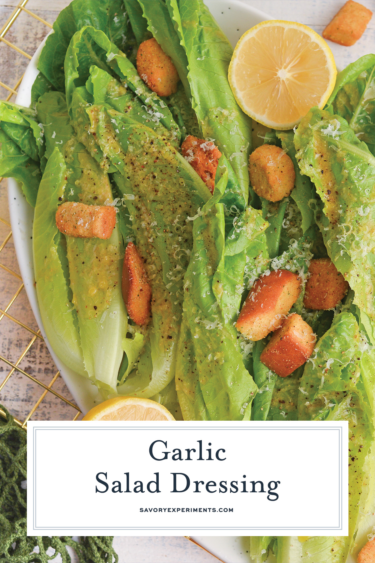 close up of garlic dressing on salad with text overlay