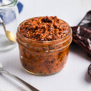 angled shot of jar of harissa sauce