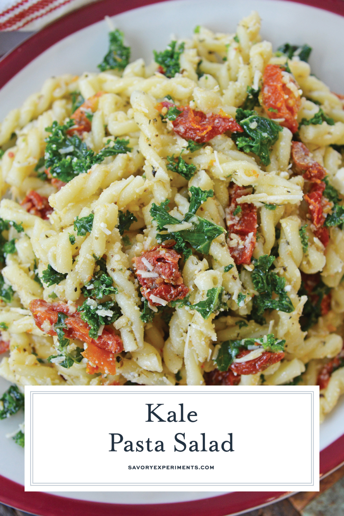 close up of kale pasta salad with text overlay for pinterest