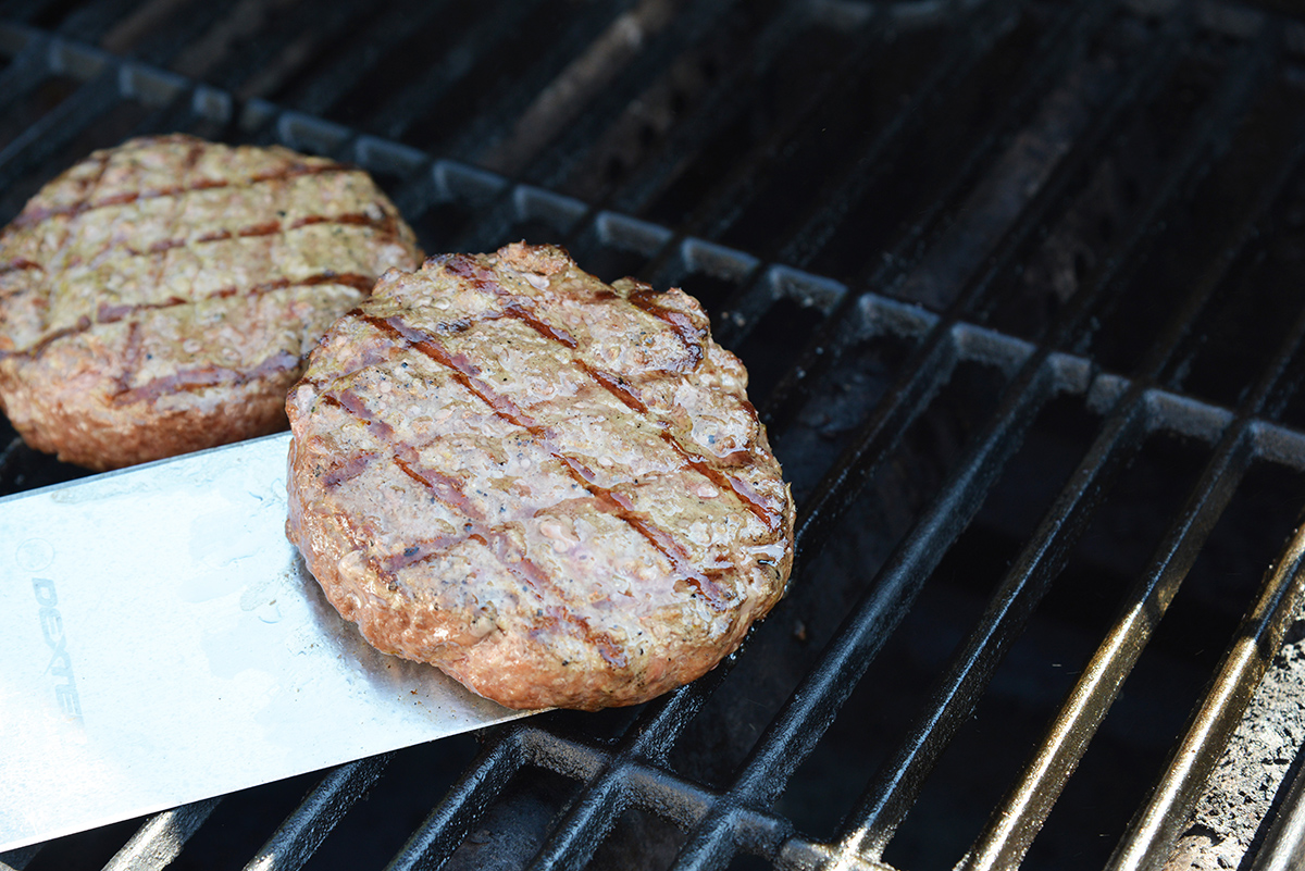 greek burgers on the grill with char marks