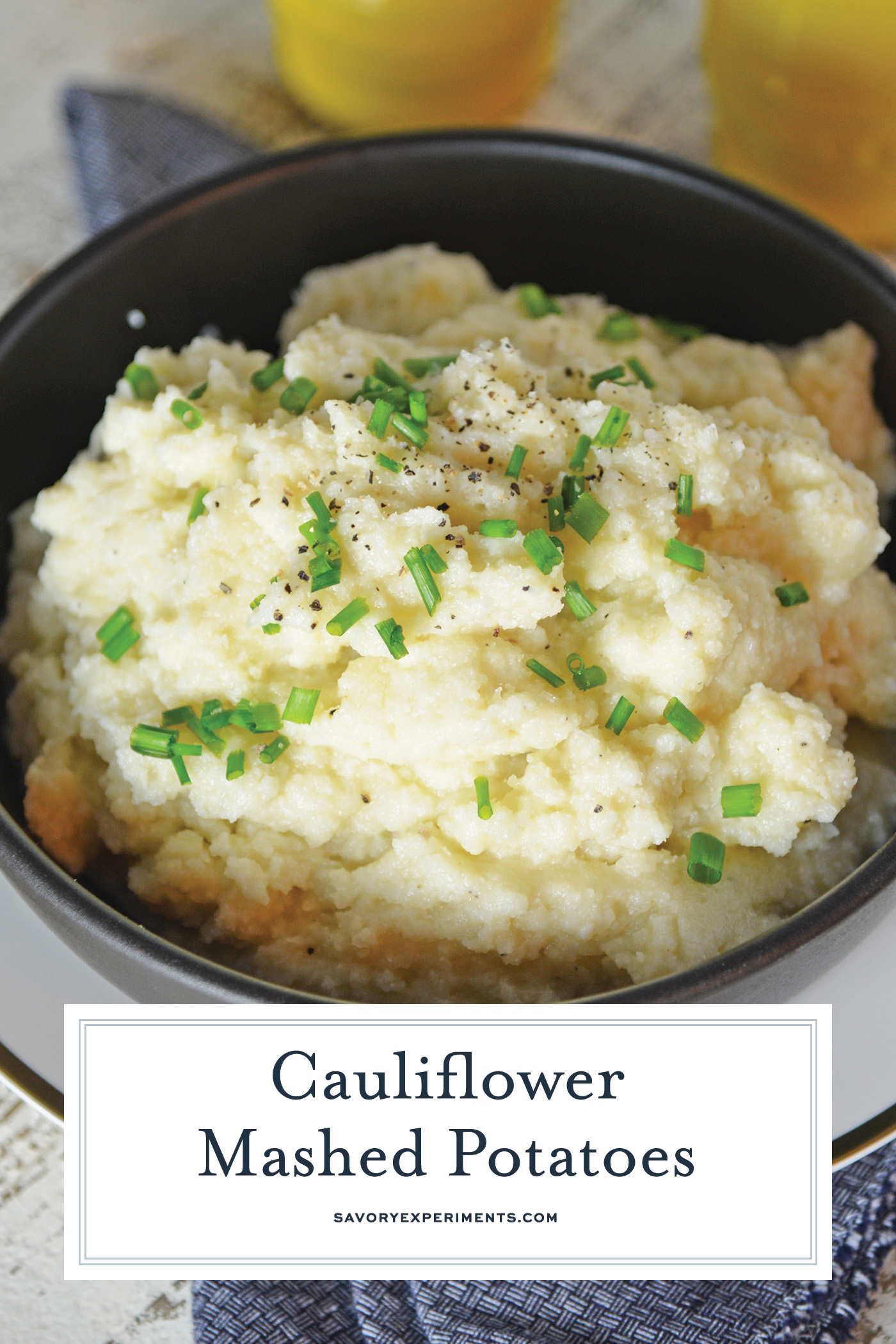 angled shot of bowl of cauliflower mashed potatoes with text overlay