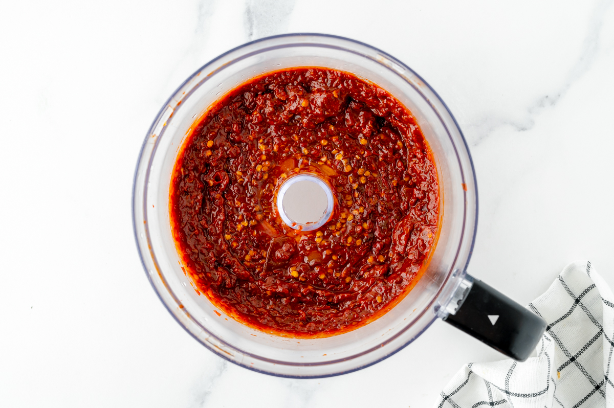 overhead shot of chipotle peppers blended in food processor