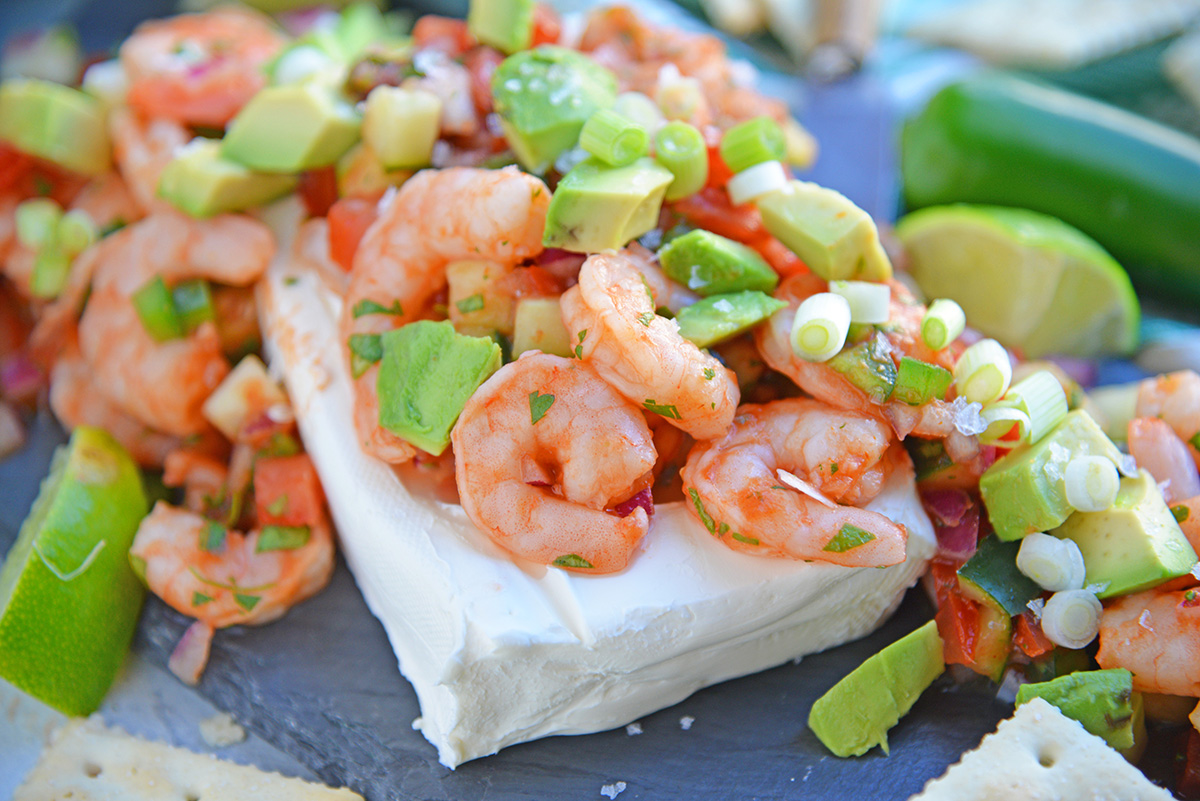 Large shrimp over cream cheese with Mexican flavors