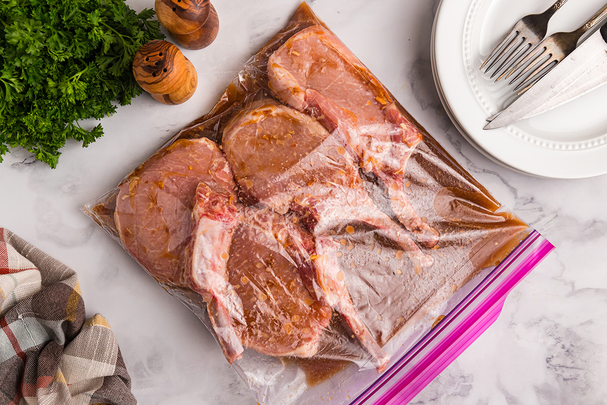 pork chops marinading in bag