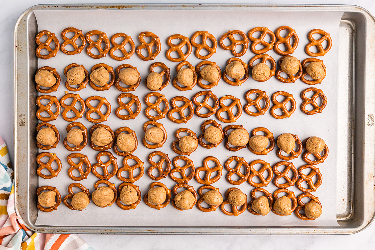 overhead shot of peanut butter balls on pretzels