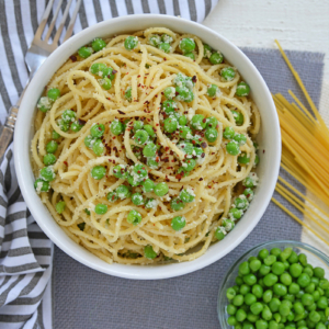 overhead shot of bowl of pasta and peas