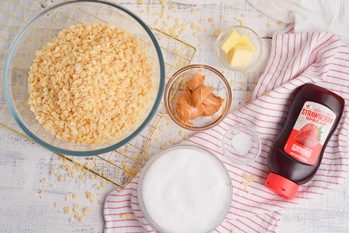 overhead shot of peanut butter and jelly rice krispie treats ingredients