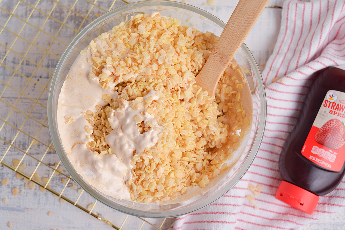 rice krispie cereal and marshmallow mixture in bowl