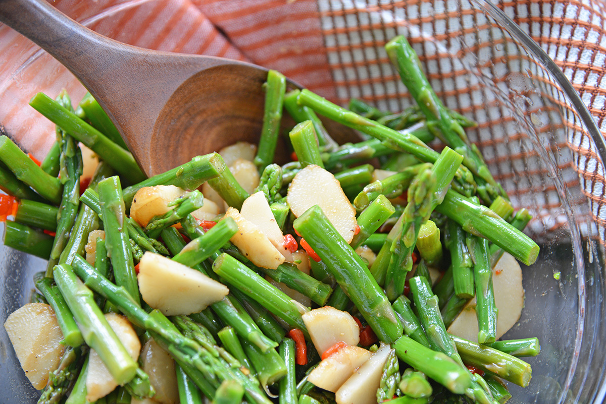 pickled asparagus salad in a mixing bowl