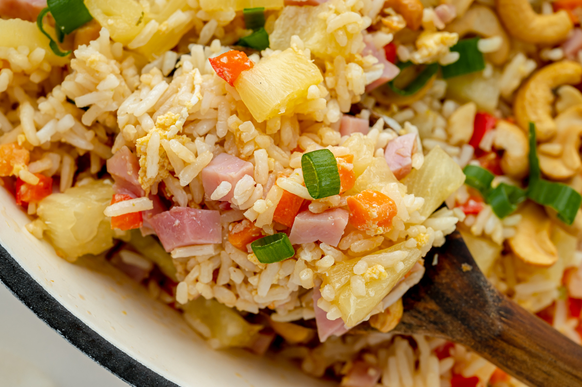 close up of pineapple fried rice on serving spoon