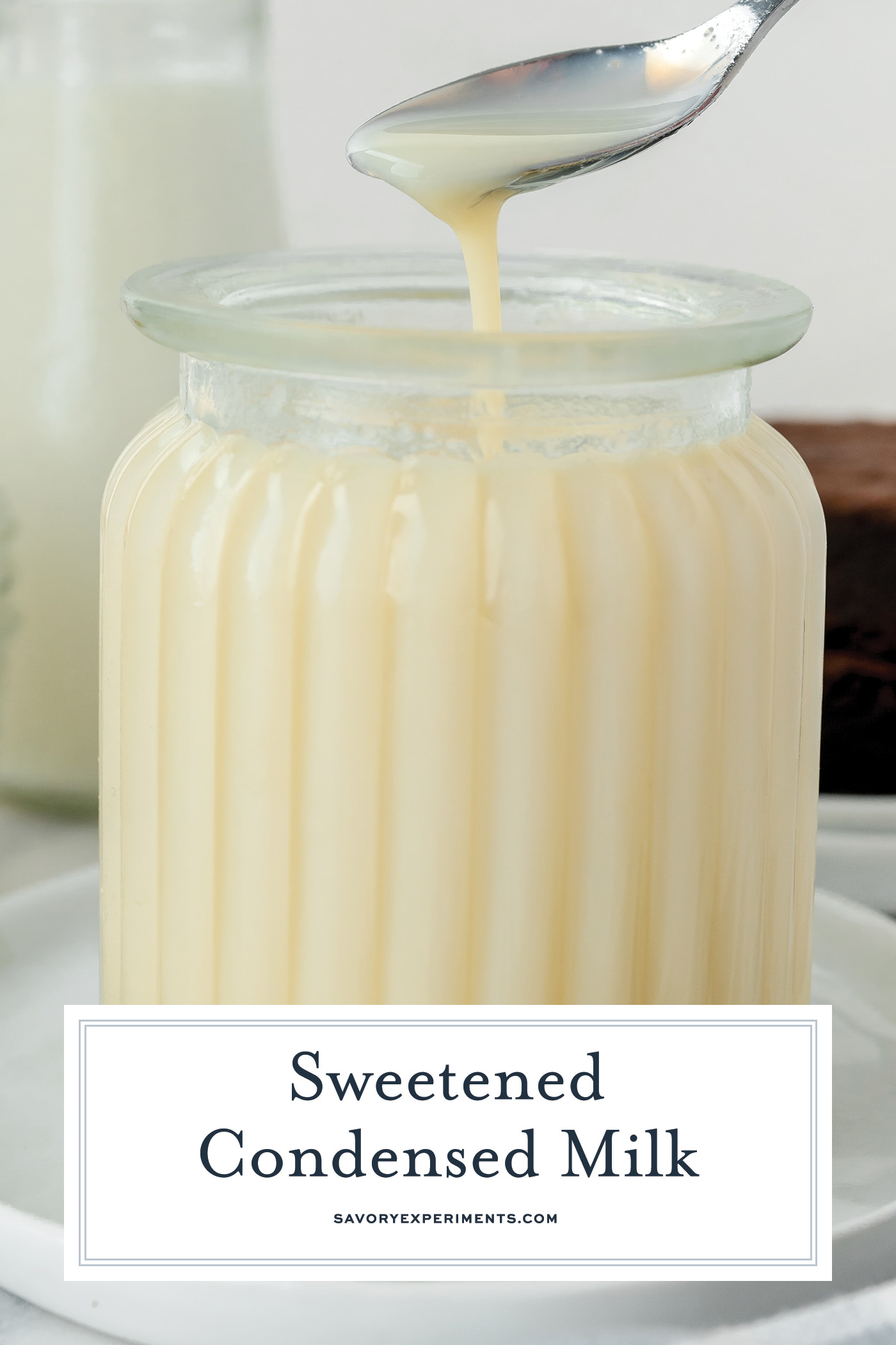 spoon in jar of sweetened condensed milk with text overlay