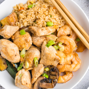 overhead of shrimp and chicken hibachi with fried rice