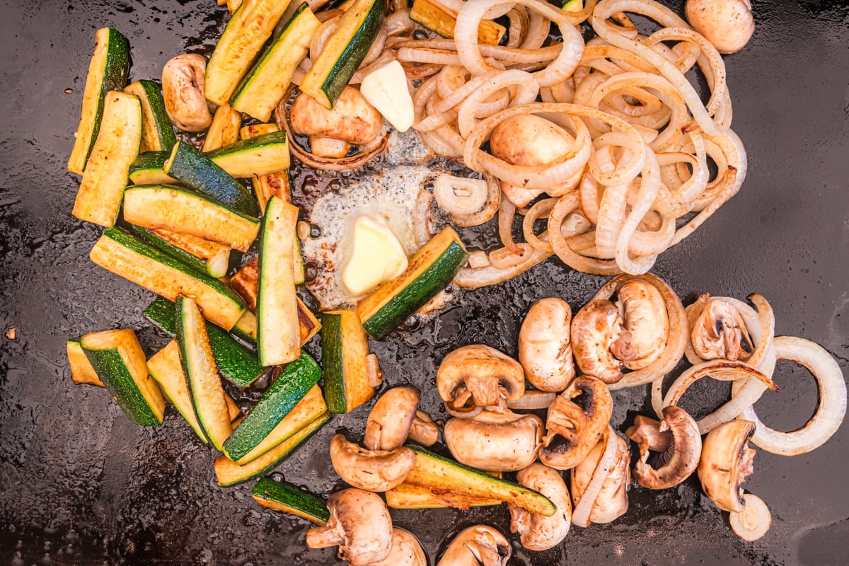 vegetables on a blackstone grill with butter 