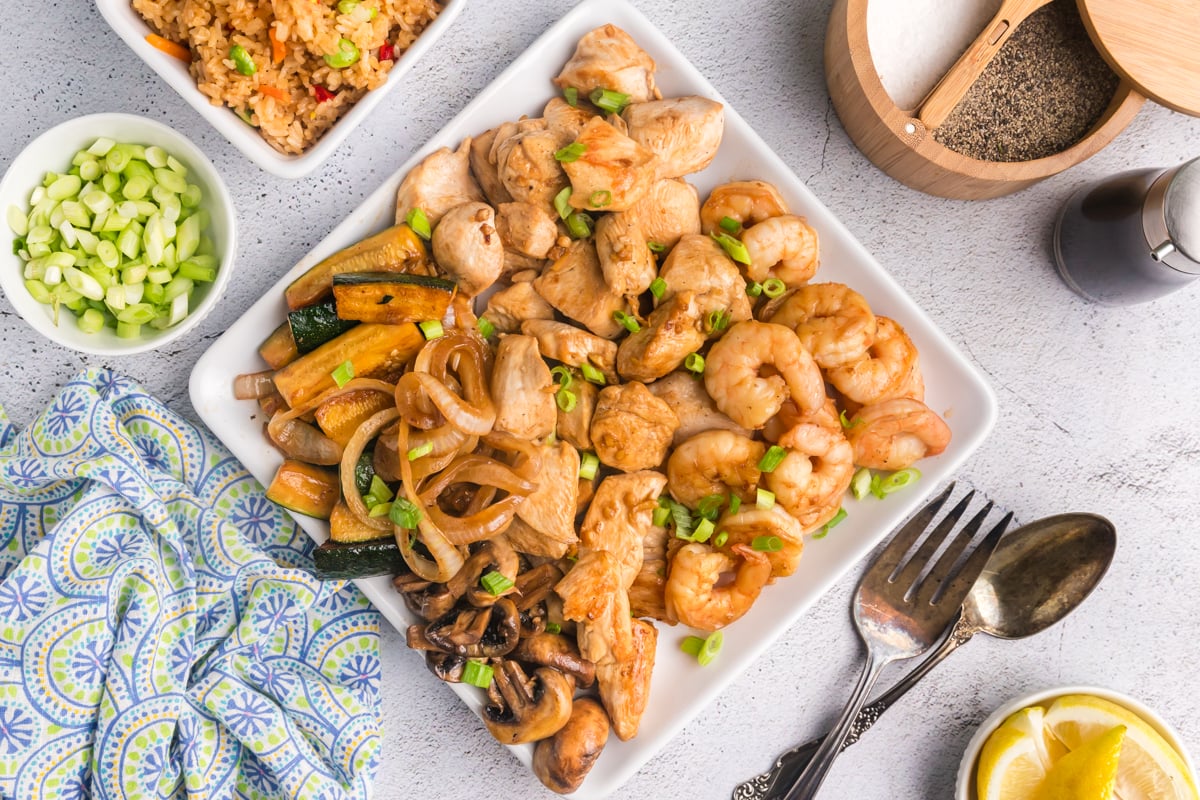 overhead serving platter of chicken and shrimp hibachi with sides