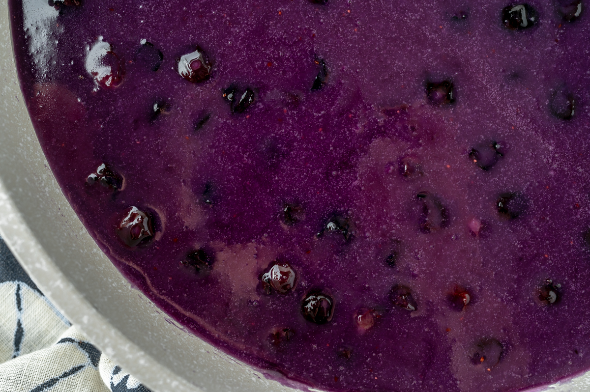 close up overhead shot of saucepan of homemade blueberry syrup