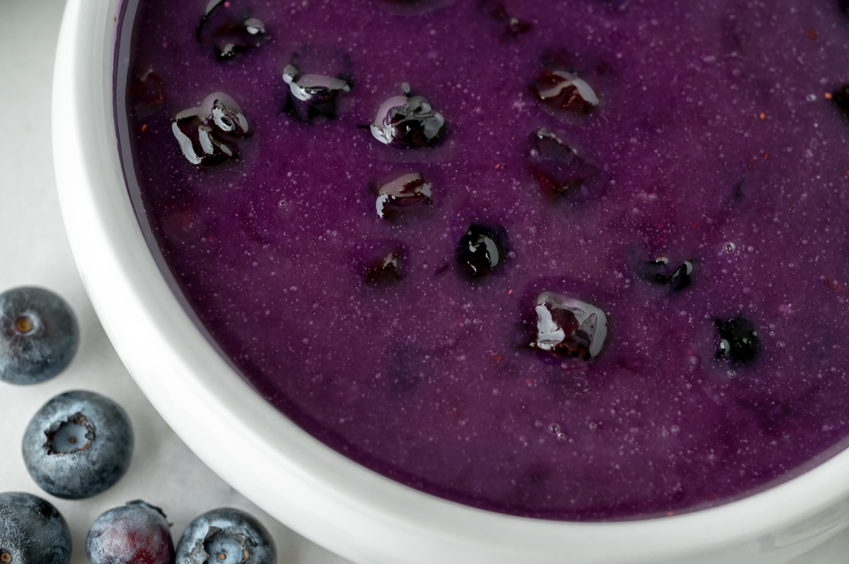 close up overhead shot of bowl of homemade blueberry syrup