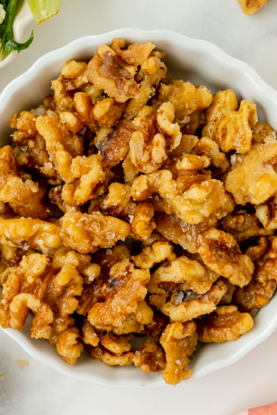 overhead shot of bowl of candied walnuts