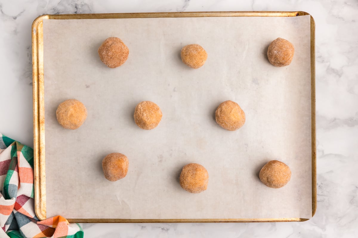 cookie dough balls on baking sheet