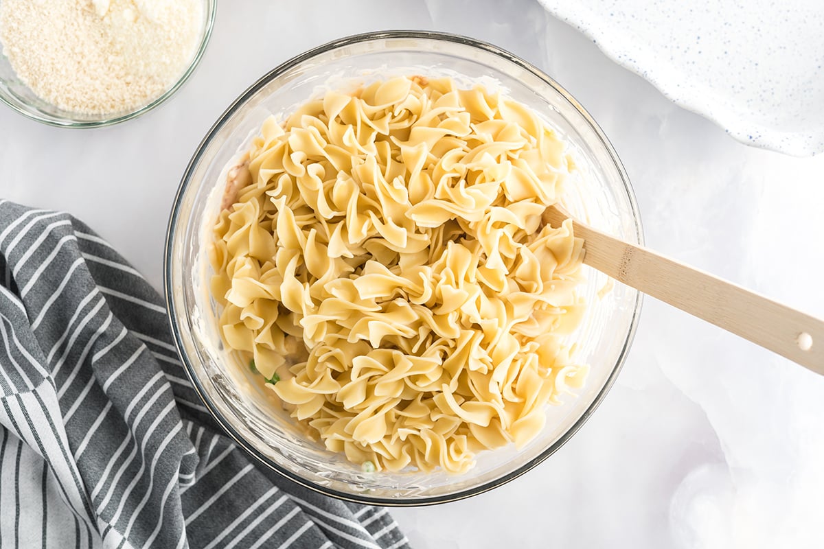 broad egg noodles in a mixing bowl