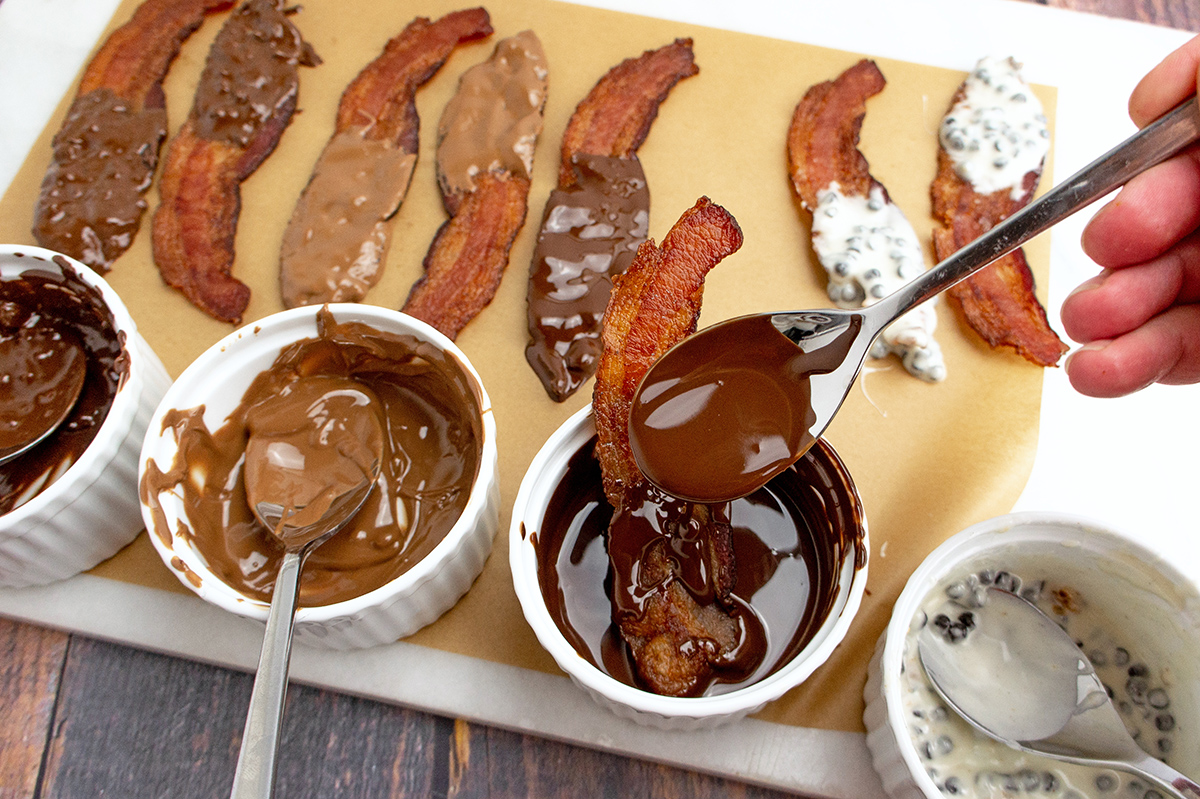 spooning chocolate onto bacon strips