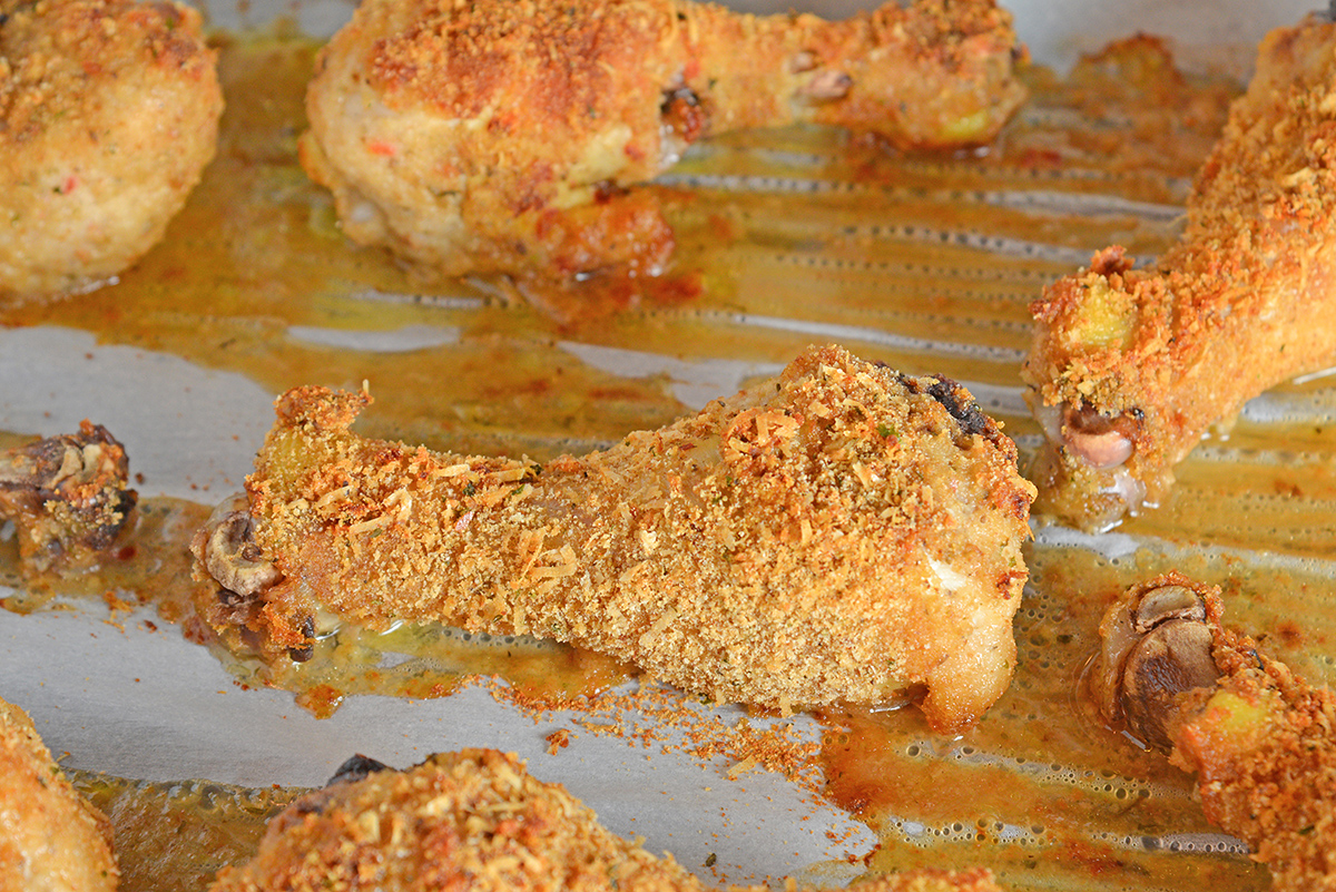 breaded baked chicken on a parchment lined paper