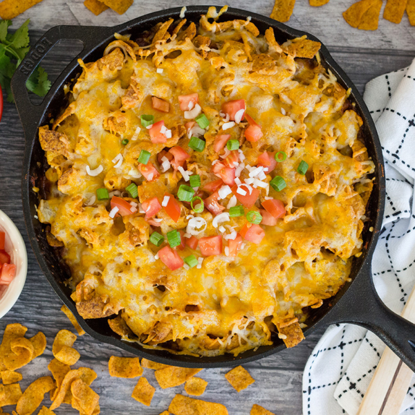 overhead of frito pie in a cast iron skillet