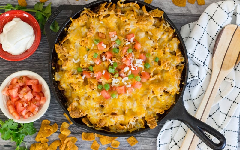 overhead of frito pie in a cast iron skillet