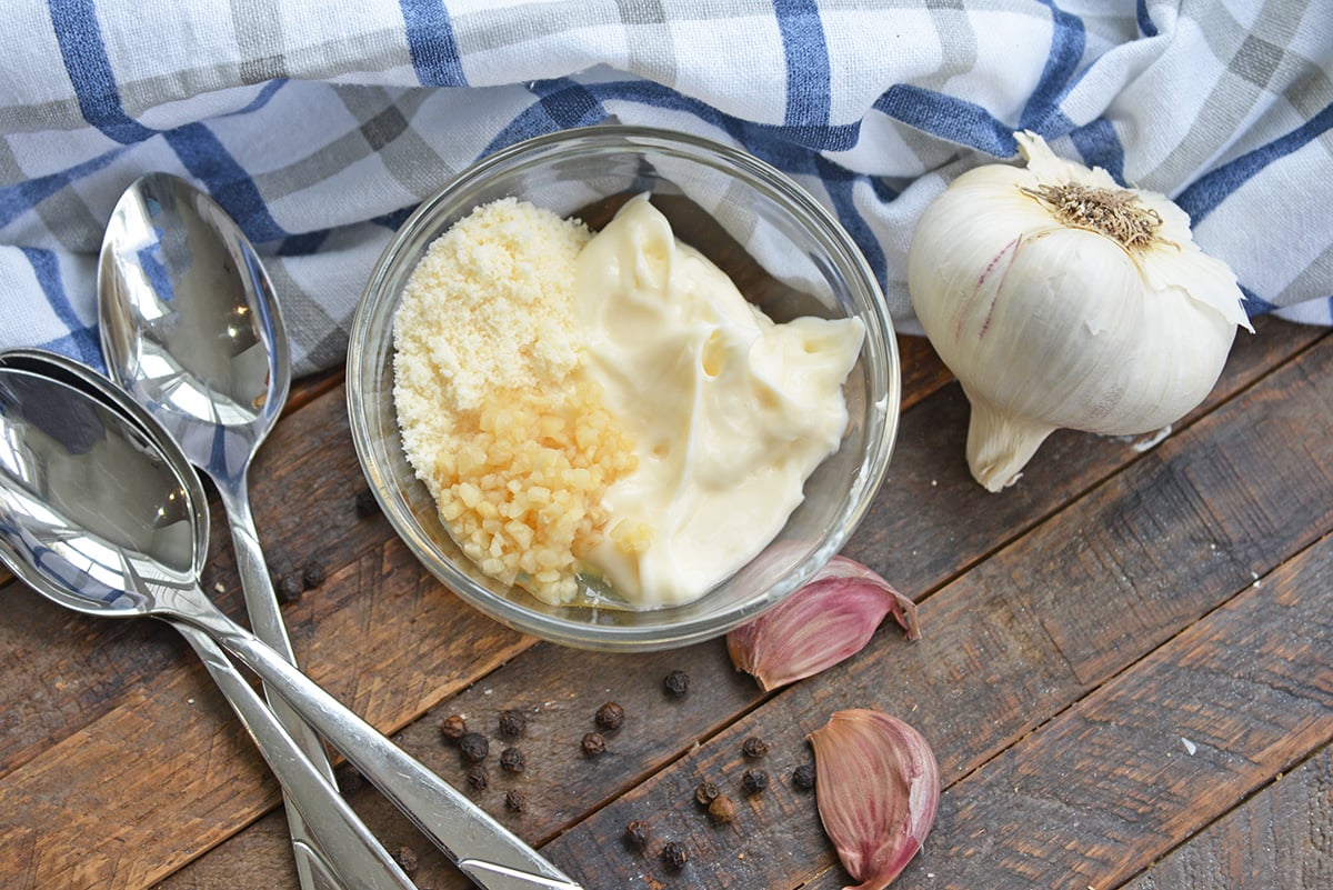 mayo chicken topping with parmesan cheese and garlic