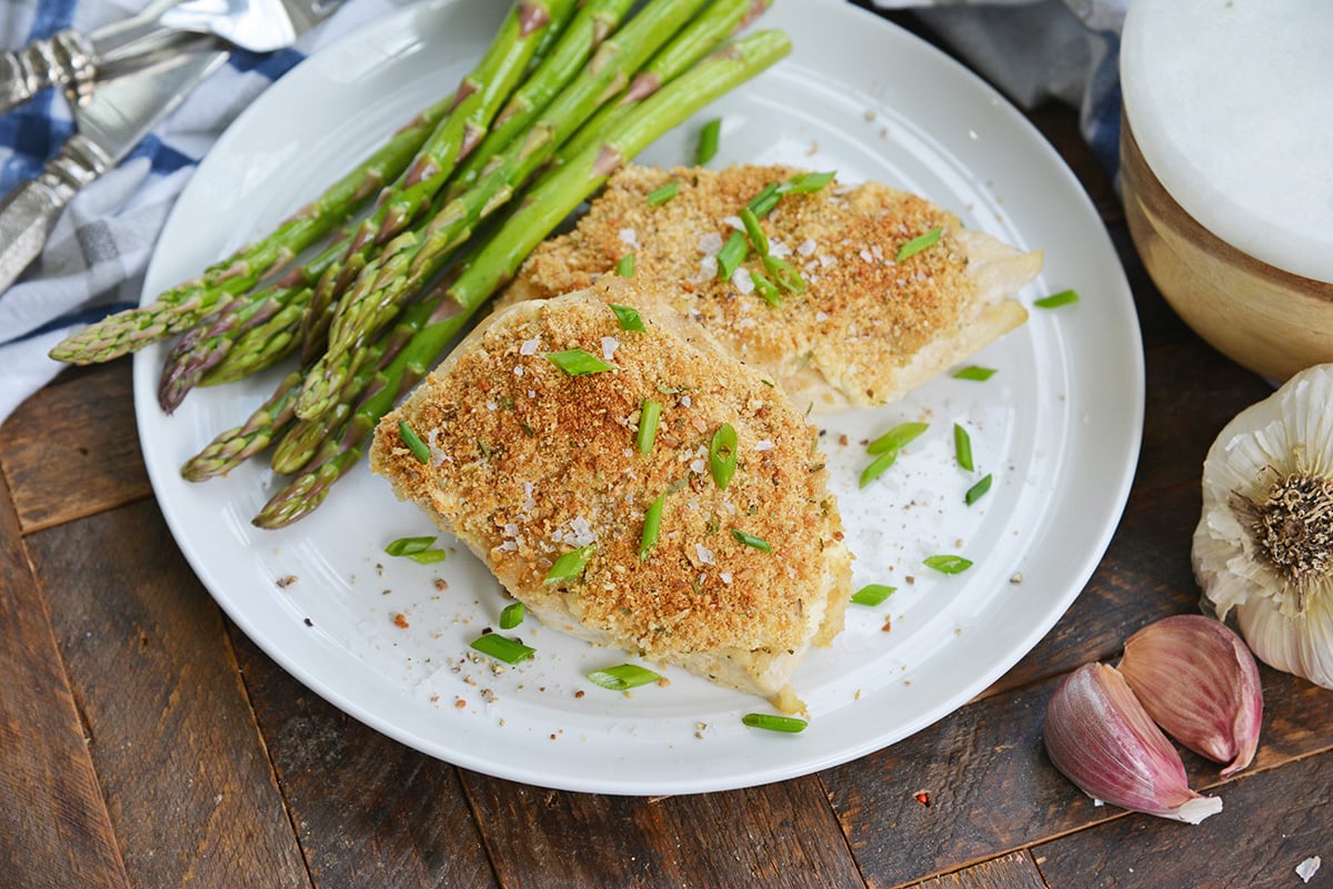 Hellman's mayo chicken on a white plate with asparagus