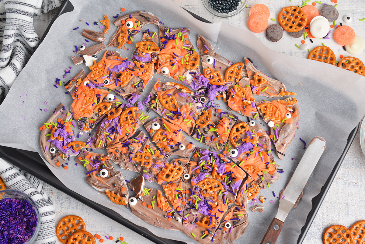 overhead shot of halloween bark pieces on sheet pan