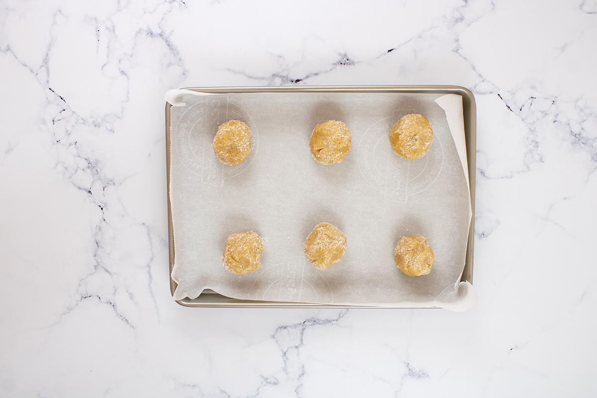 peanut butter cookie dough balls on sheet pan