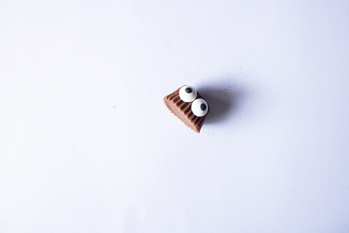 overhead shot of candy eyes on a peanut butter cup