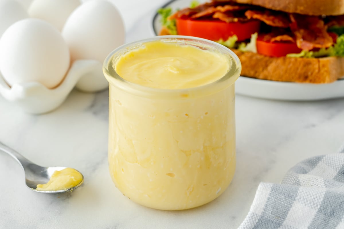 angled shot of jar of homemade mayonnaise